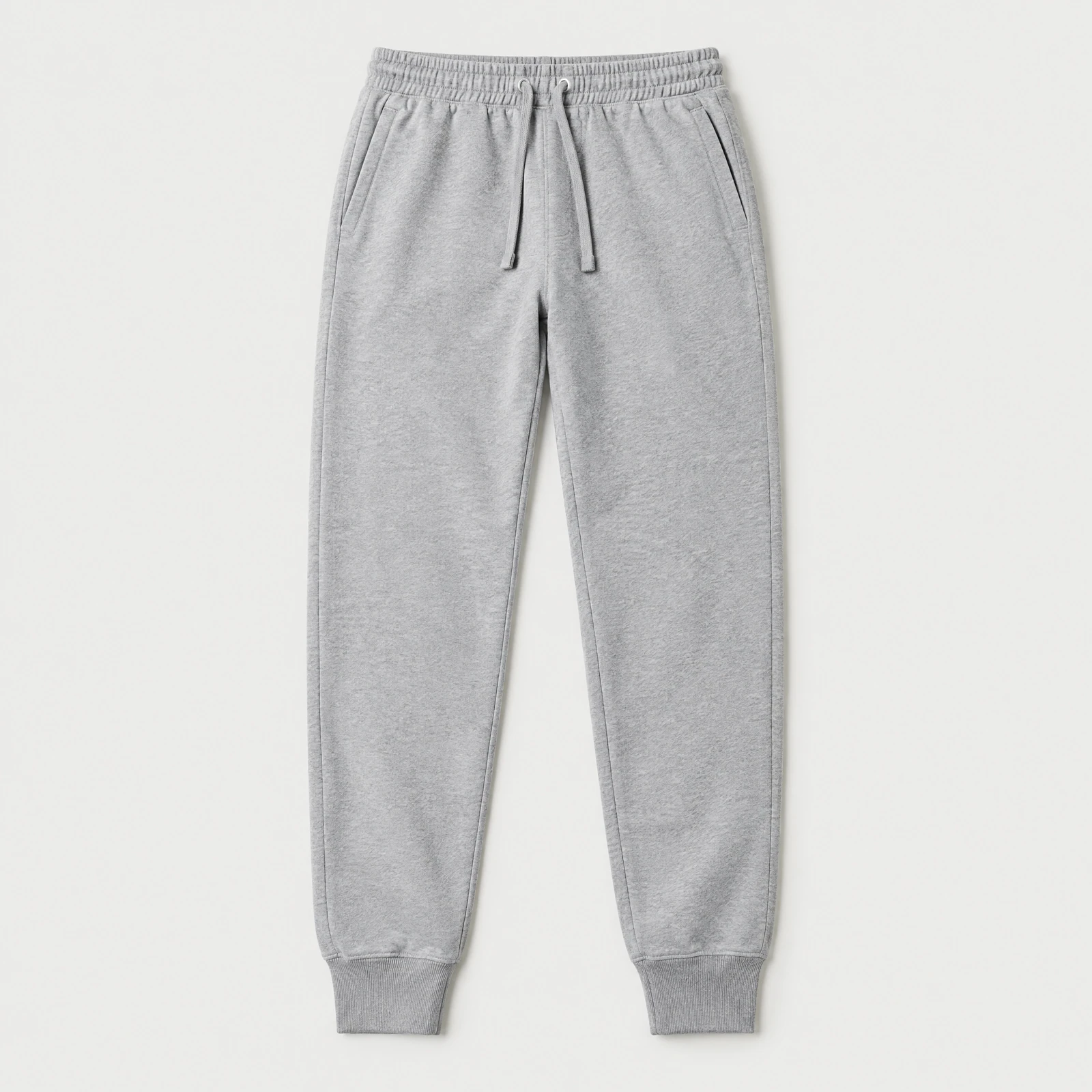 Heather gray joggers with a drawcord waist and ribbed ankle cuffs laid flat on a light gray background